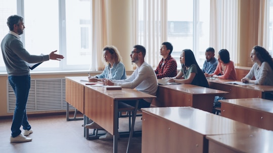 Teacher lecturing students in a classroom setting