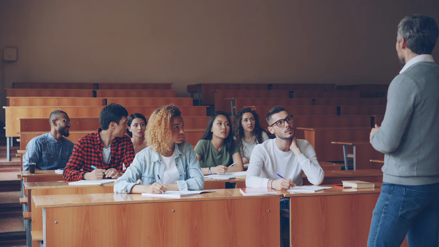 Tutor teaching students in a classroom