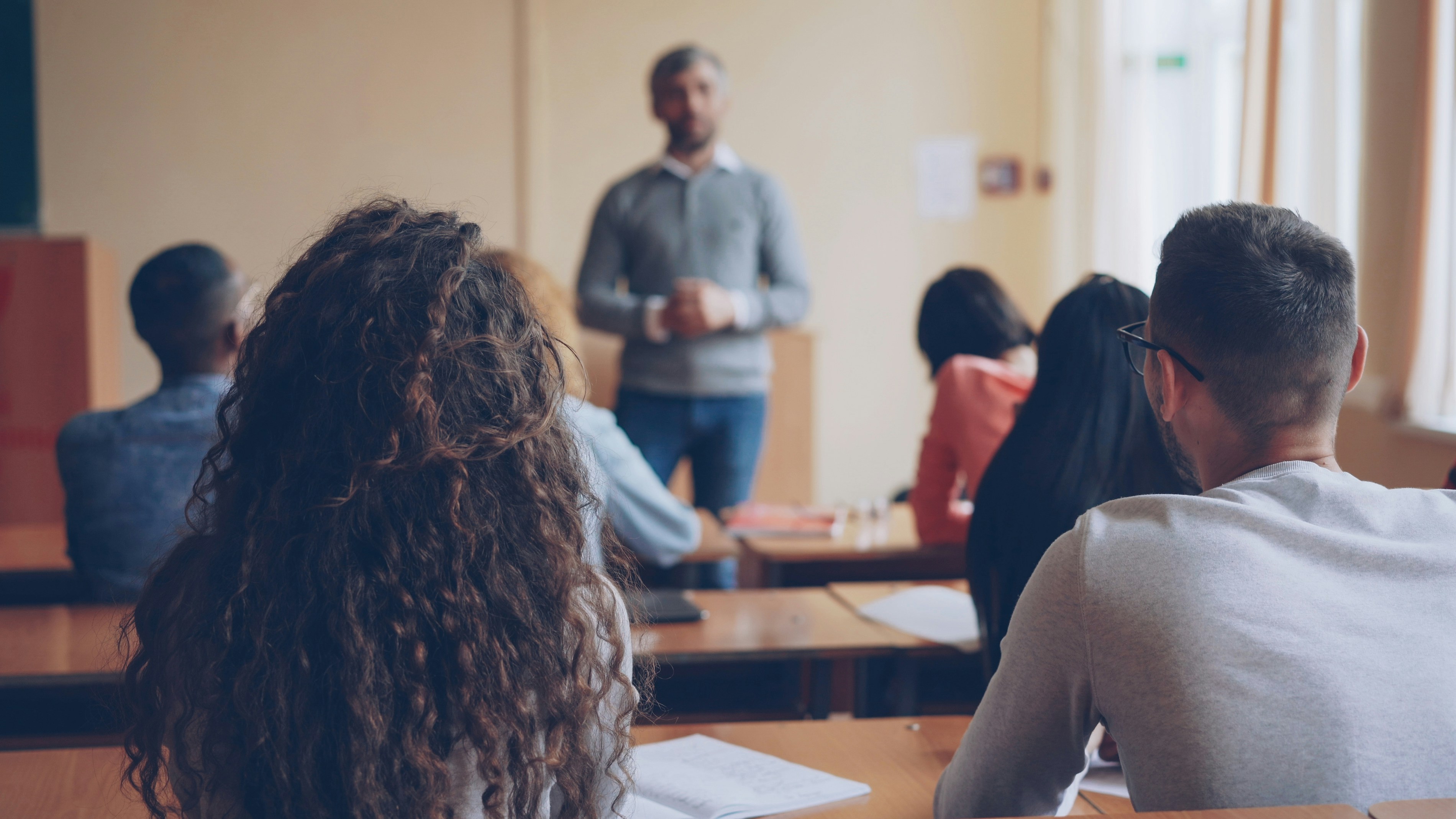 Students listening to experienced teacher