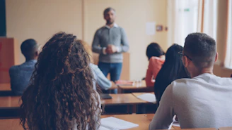 Teacher instructing students in a classroom setting
