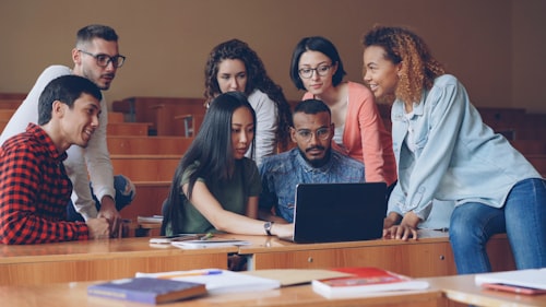 Diverse tertiary students with laptop