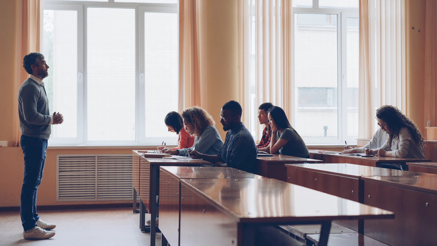 Adult students in a classroom for long-term study and integration