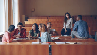 Students talking in a lecture hall classroom