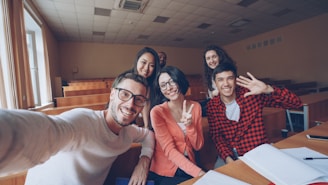 Group of students taking a selfie in a classroom