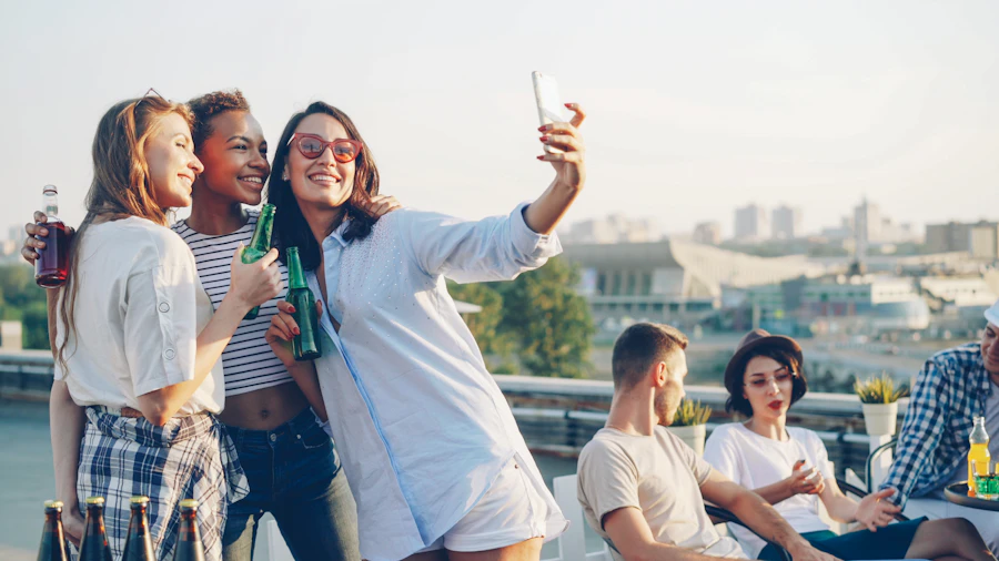 Friends at a bright rooftop venue, phone in hand