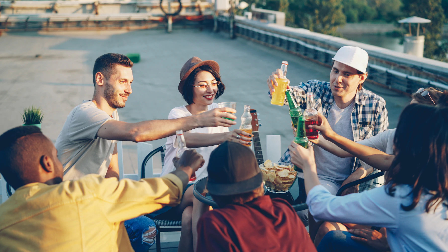 Illustrative editorial scene of friends sharing a joyful moment outdoors in warm evening light.