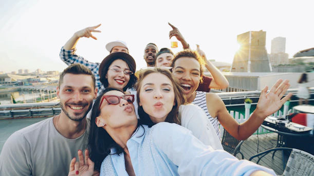 Group of friends taking a selfie on a rooftop