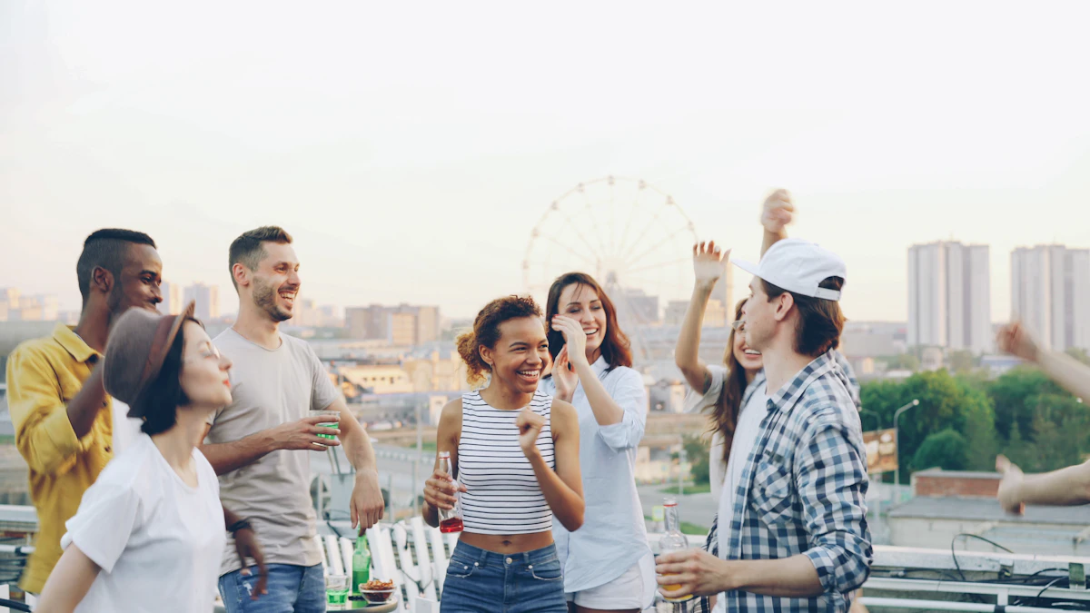 Friends dancing together at a rooftop party