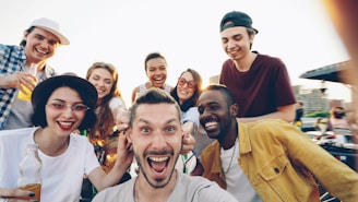 Group of diverse friends taking a selfie outdoors