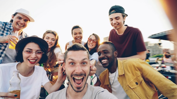 Group of diverse friends taking a selfie outdoors