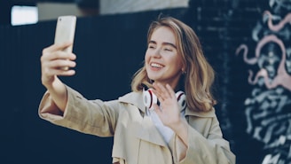 Young woman taking a selfie with headphones