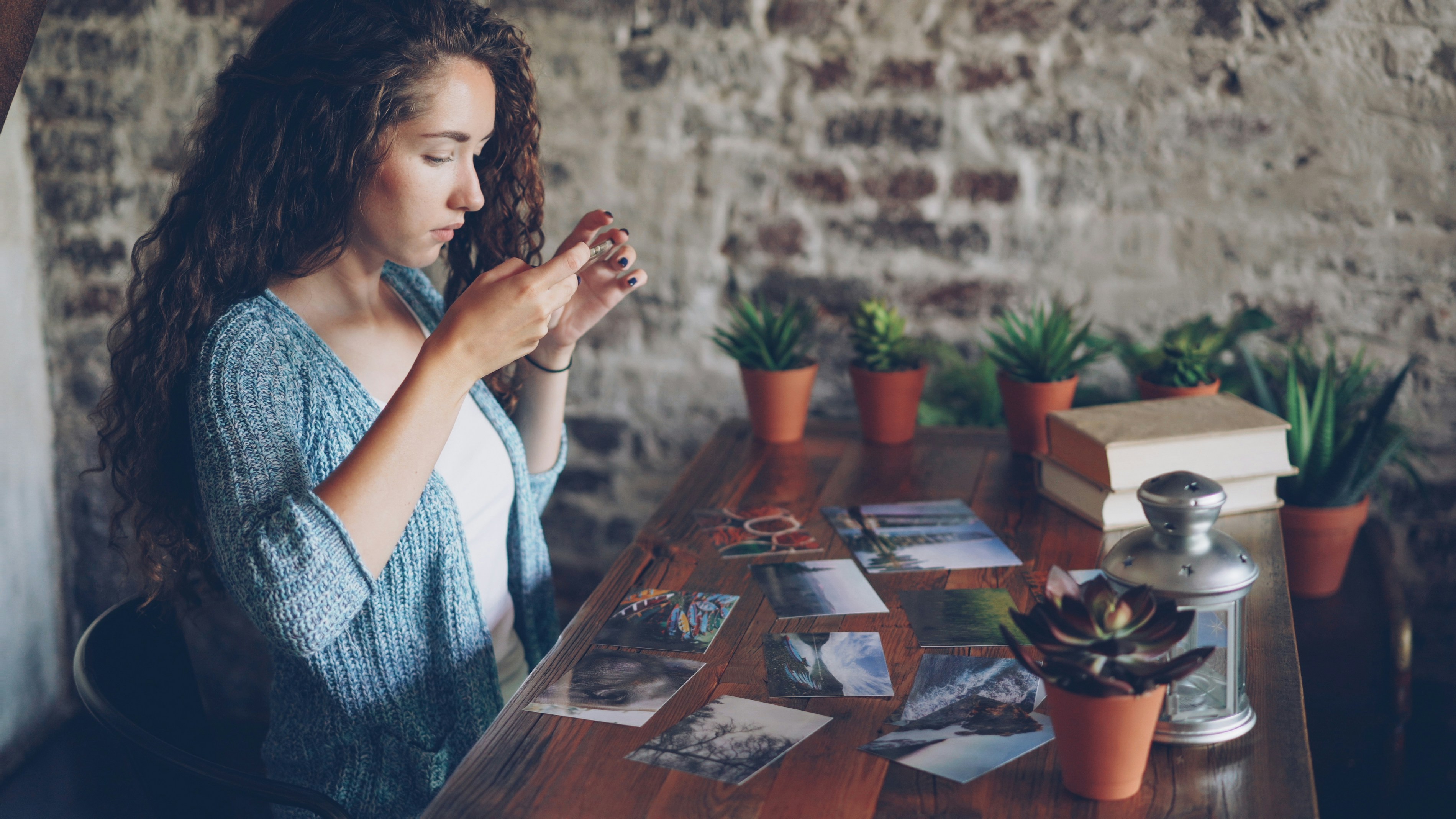 Designer arranging photographs on a table