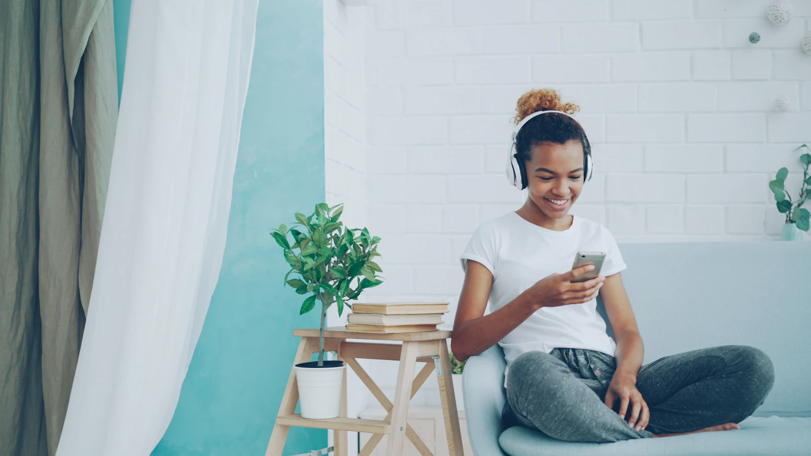 Person using a phone during some spare time at home