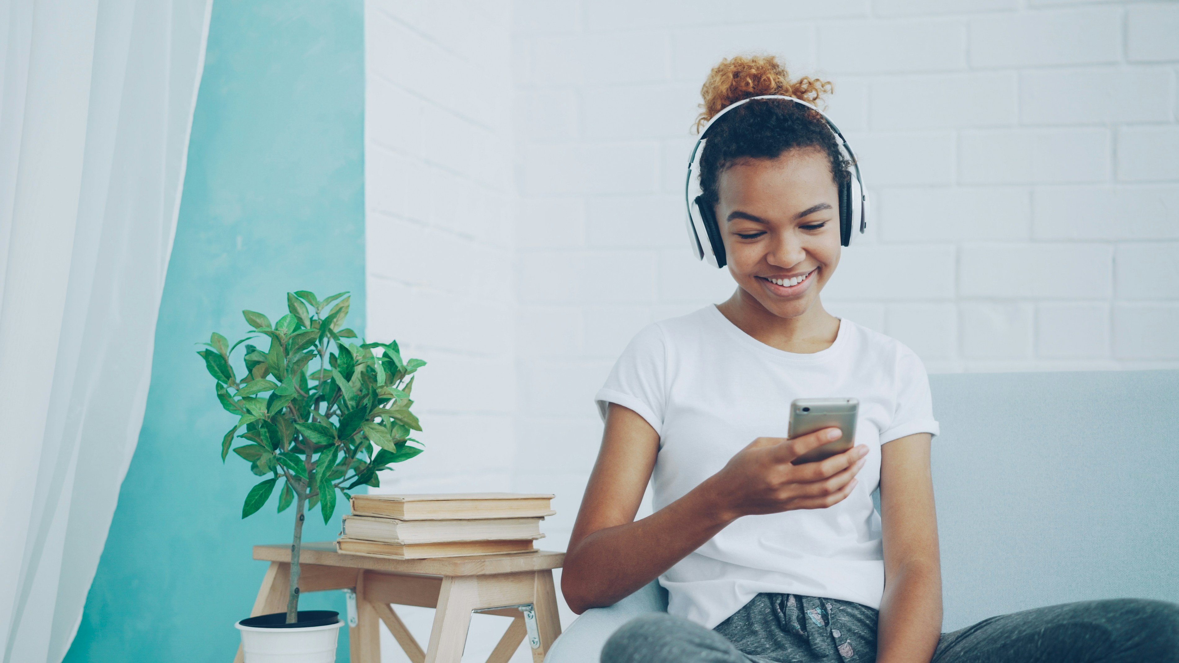 Happy African American woman listening to music