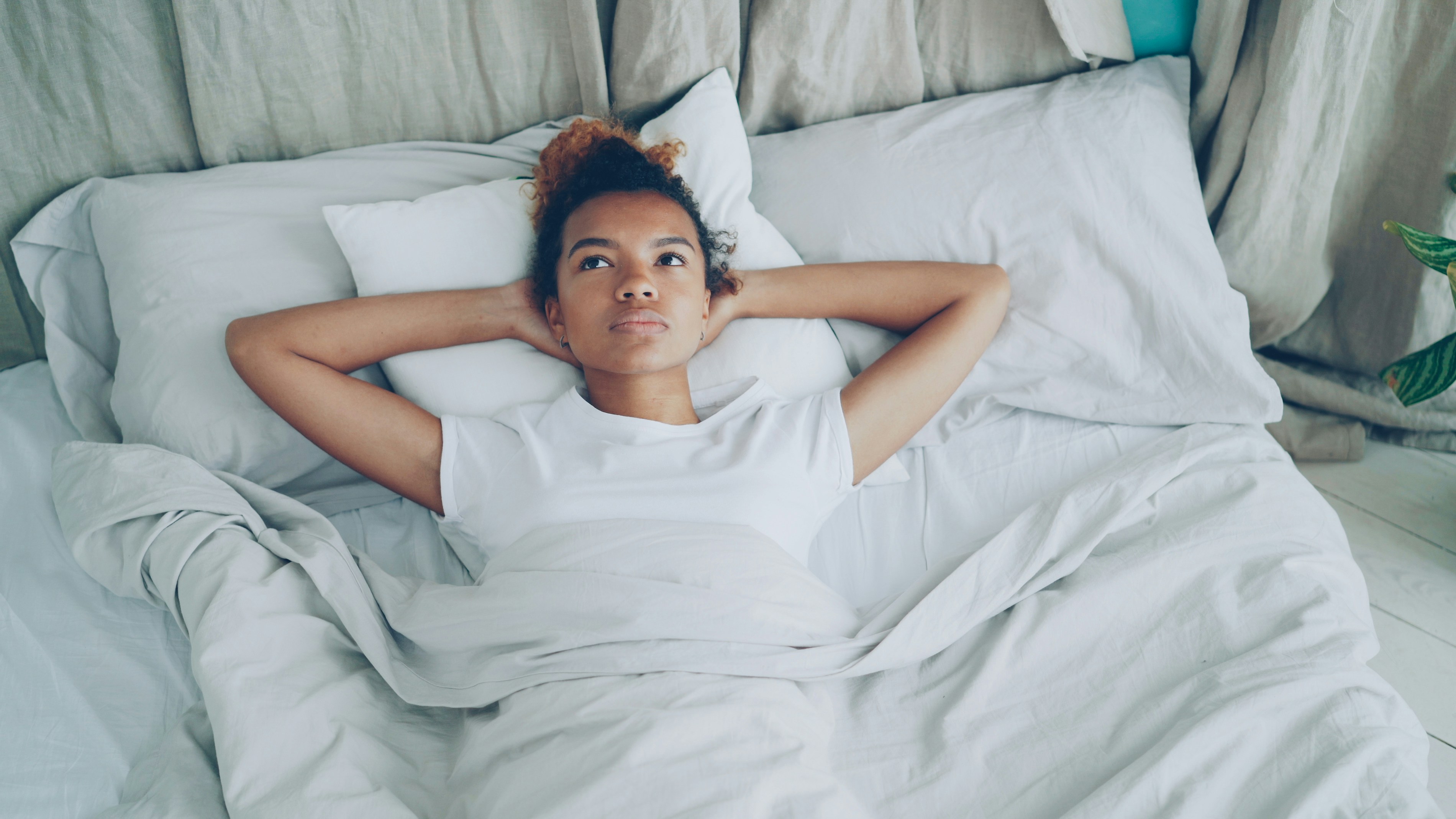 Woman resting peacefully in bed