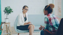 Two women talking in a therapy session