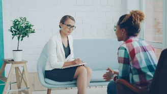 Two women talking in a therapy session