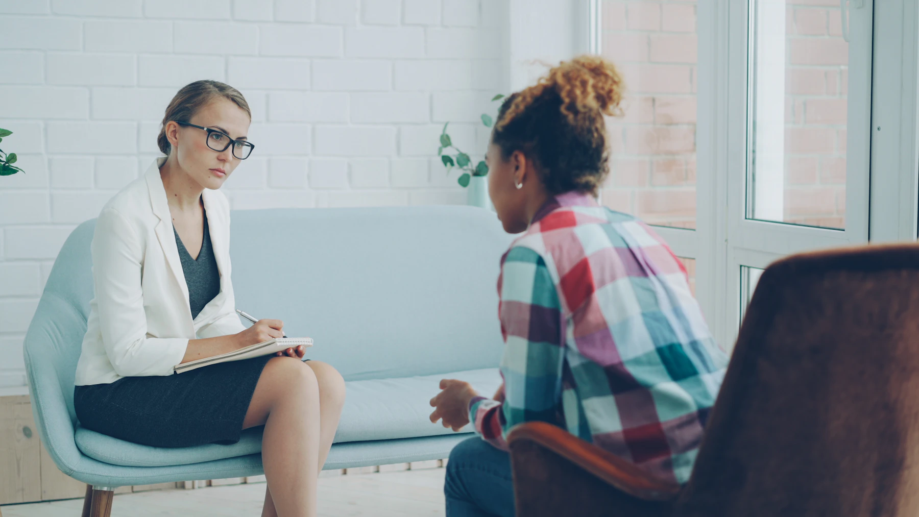 Mental health professional listening to a patient during a thoughtful care consultation