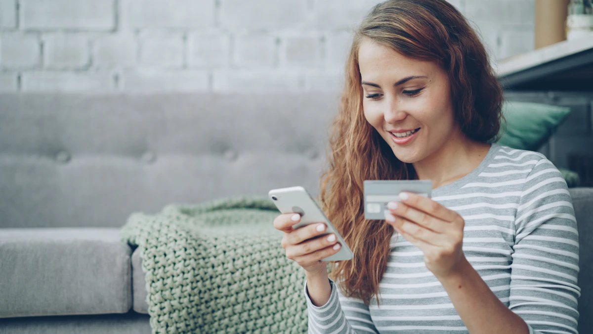 Woman shopping online with credit card and smartphone