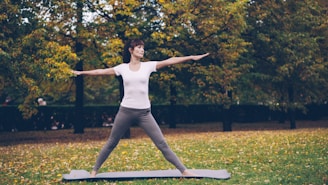 Woman practicing yoga in a park