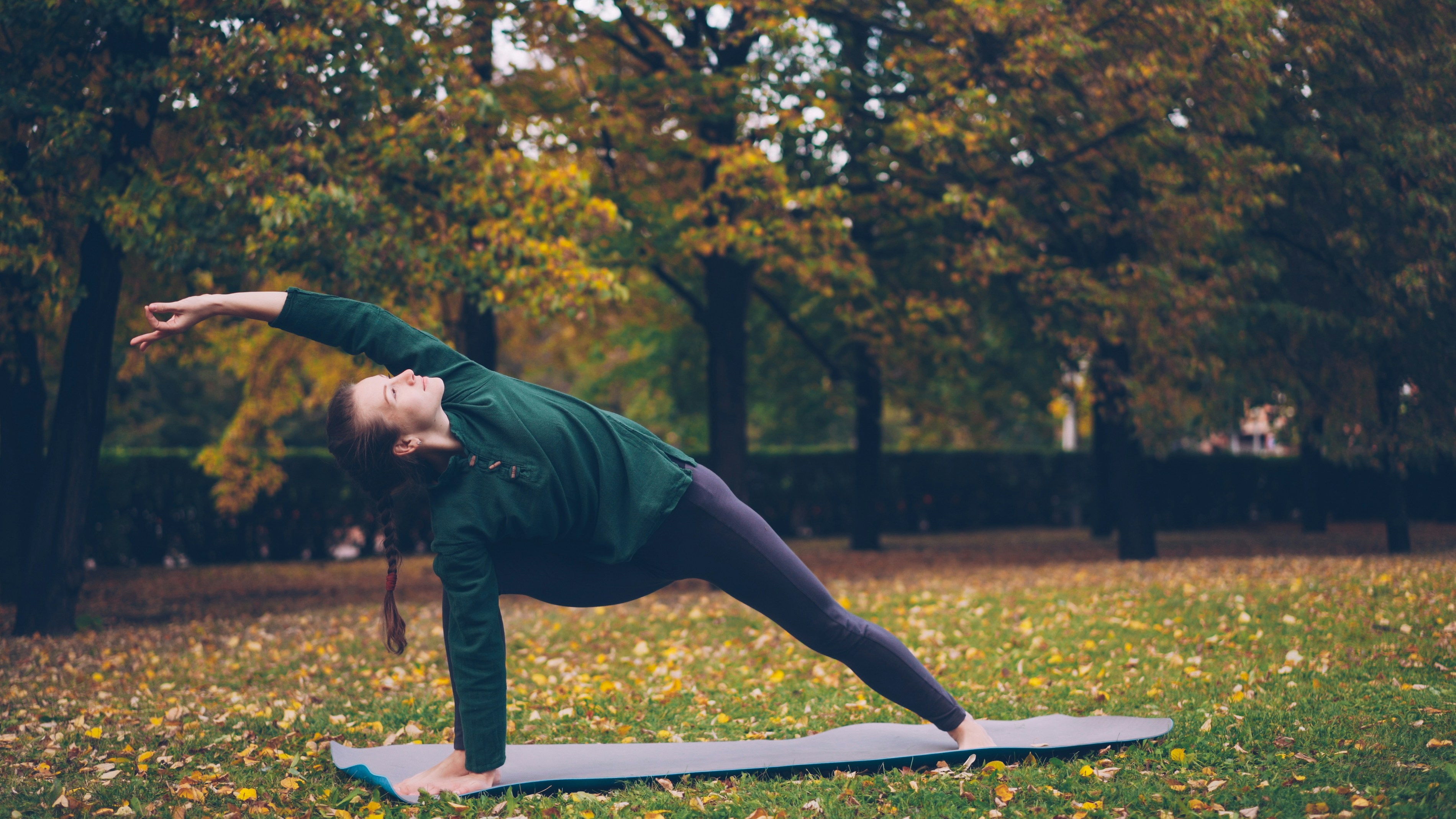 Young woman doing yoga in nature