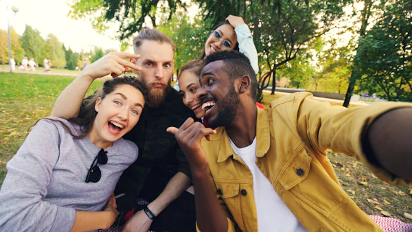Group of friends taking a selfie outdoors