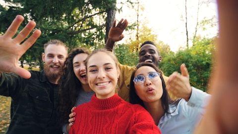 Group of friends taking a selfie outdoors