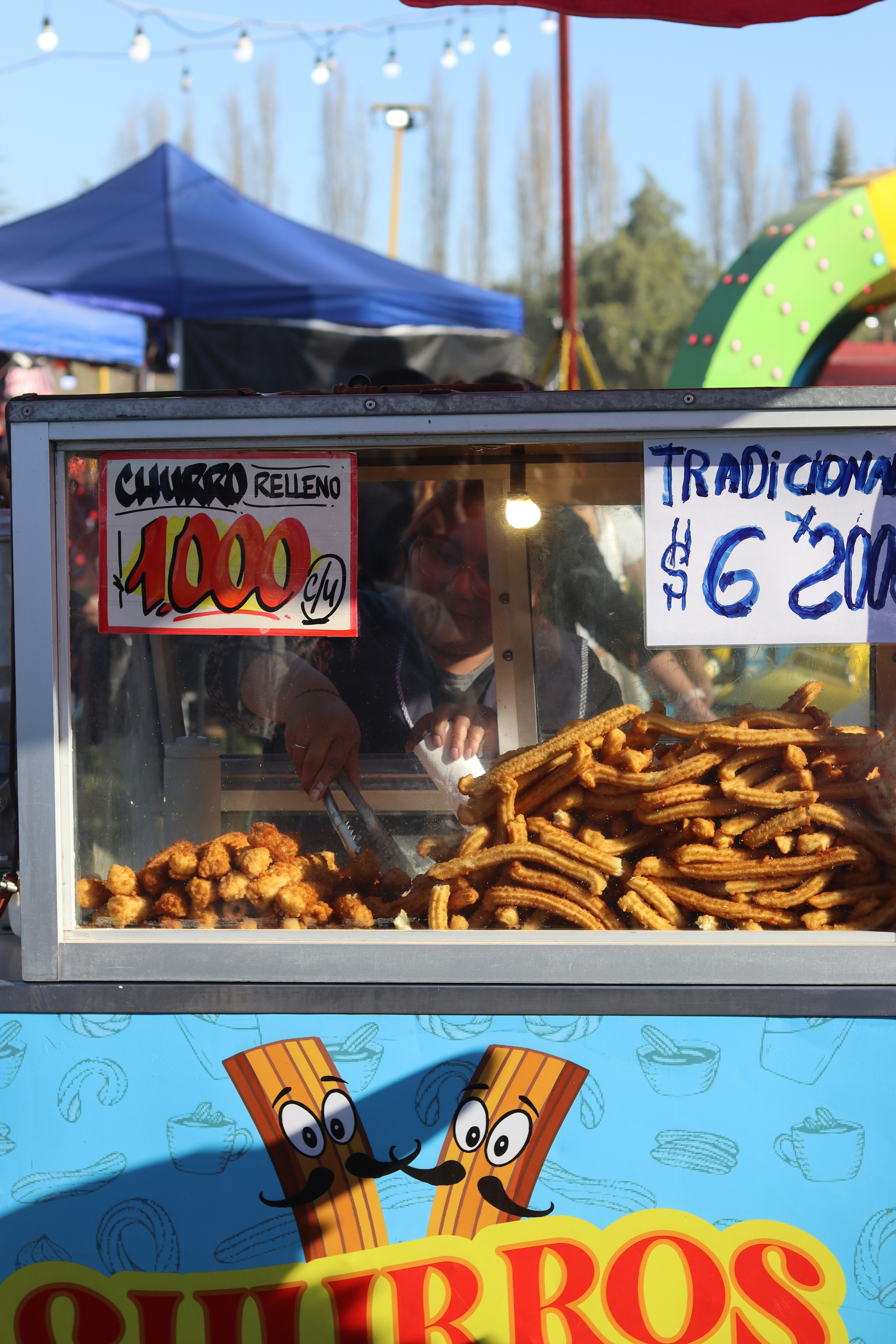 Churros for sale at a street food stall.
