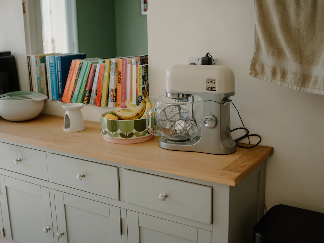 Real kitchen counter with food preparation appliance and everyday kitchen essentials