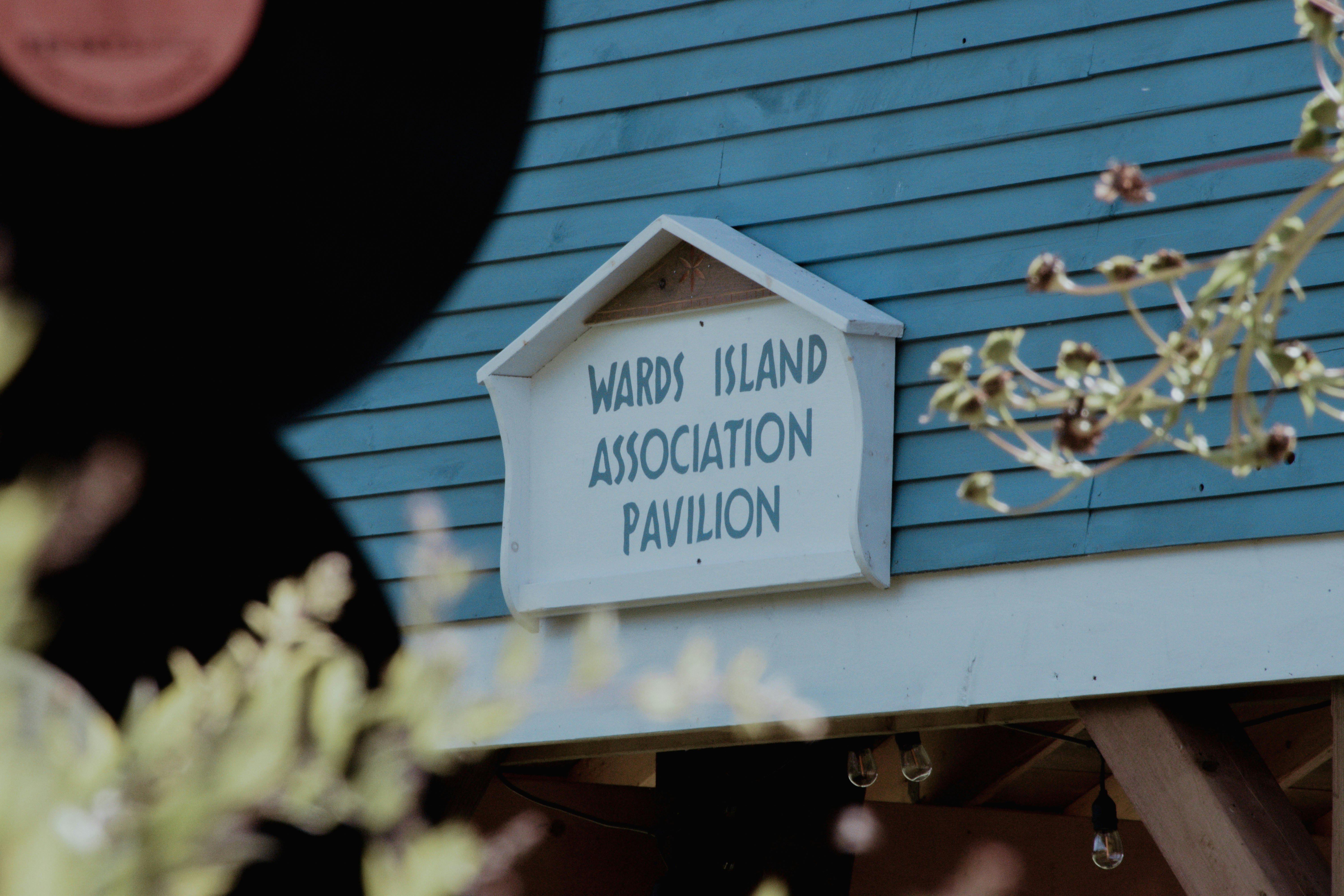 Wards island association pavilion sign on blue building