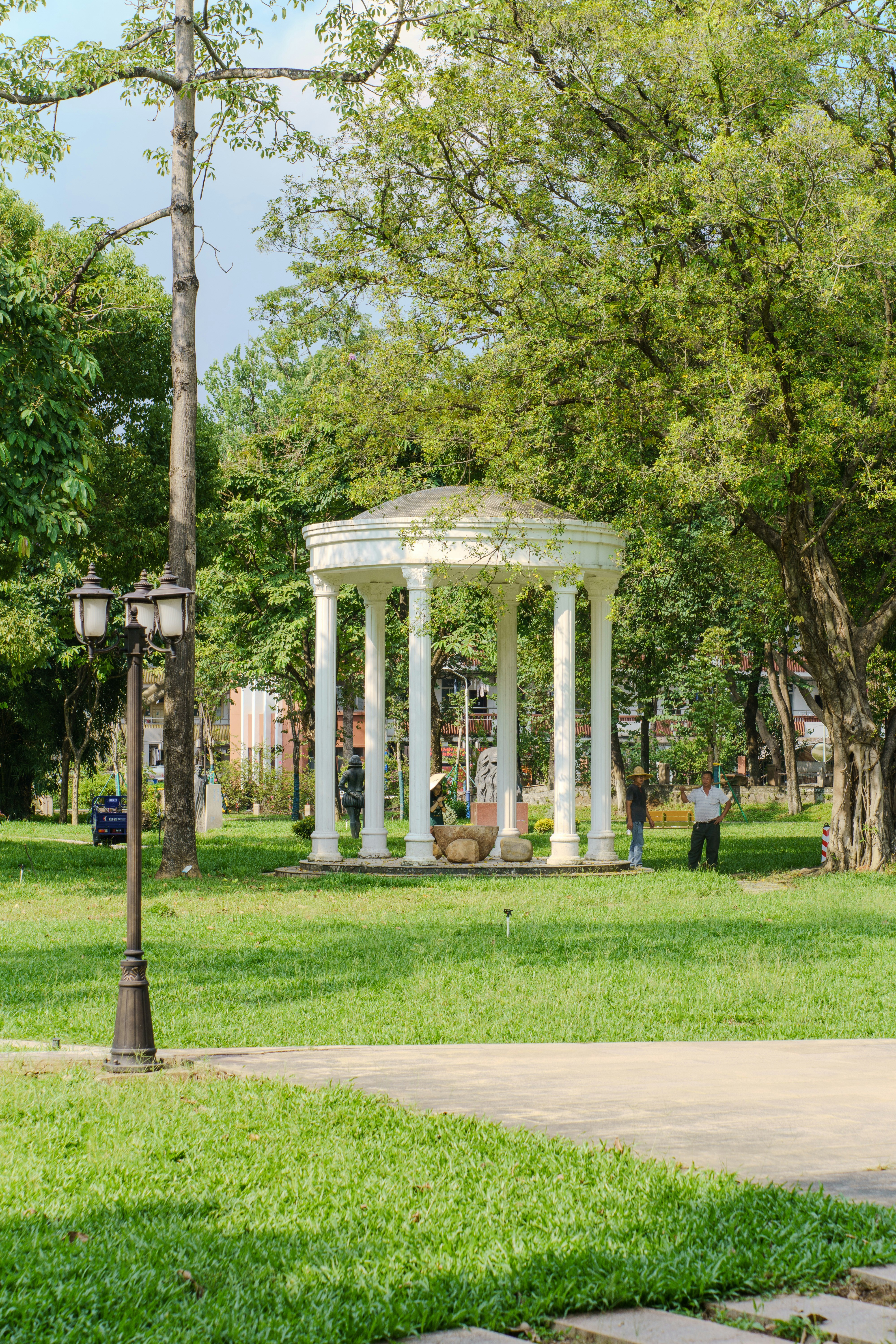 Gazebo with columns in a sunny park setting