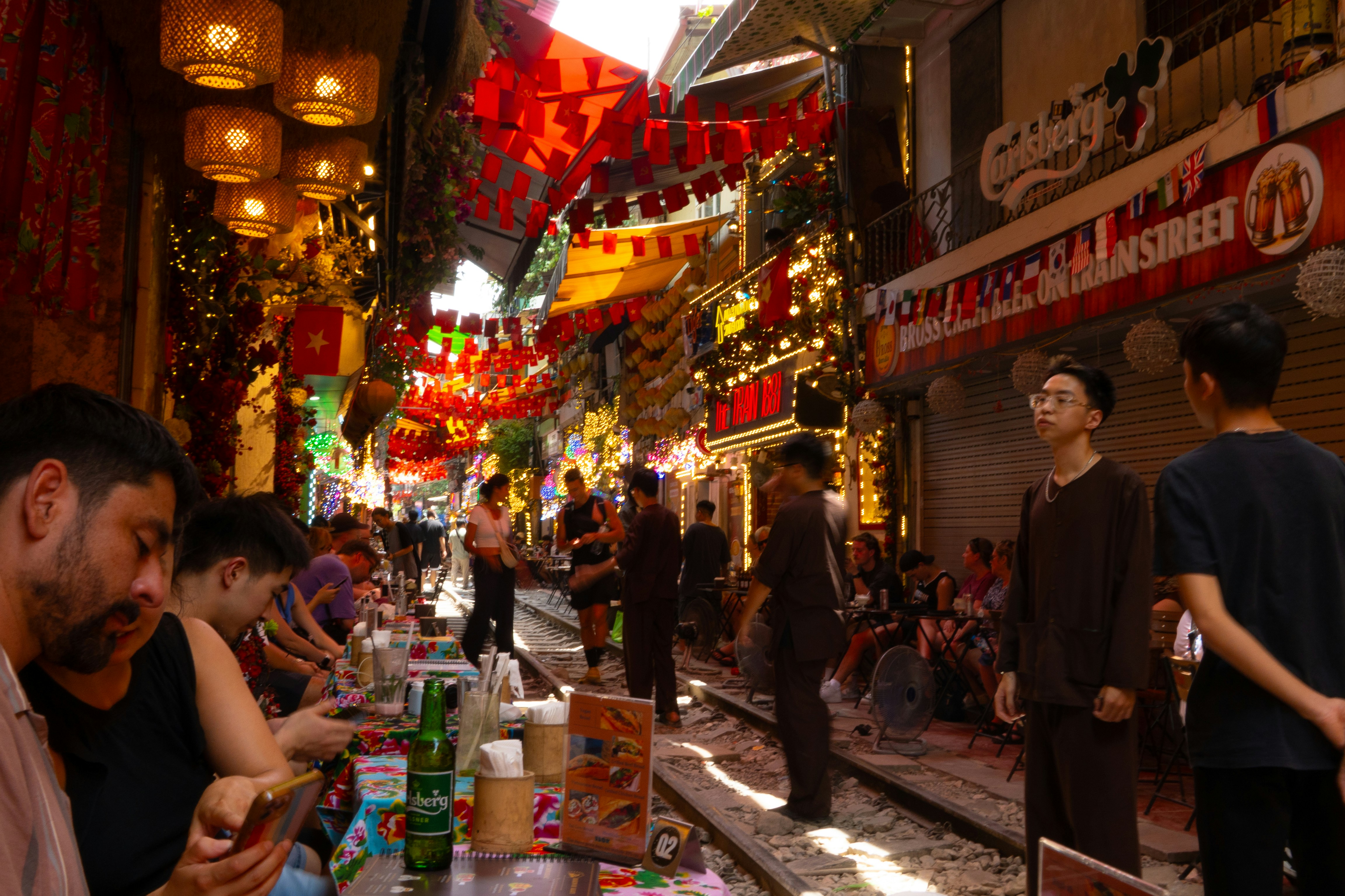 People dining on a lively street in Vietnam