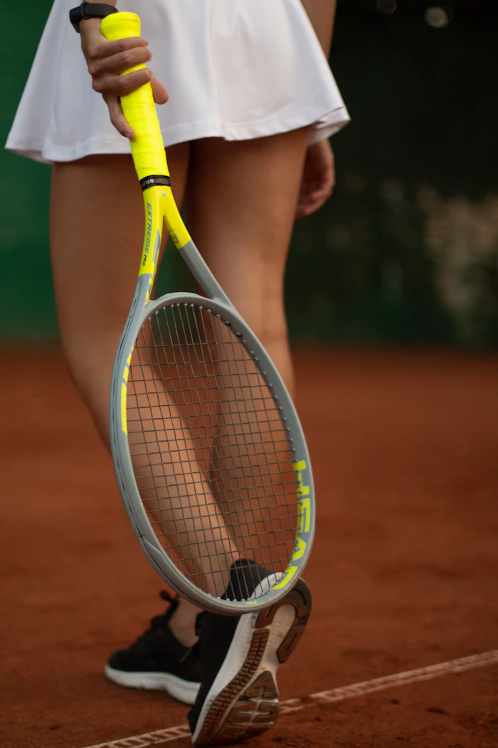 Player on a clay tennis court. Stock photograph.