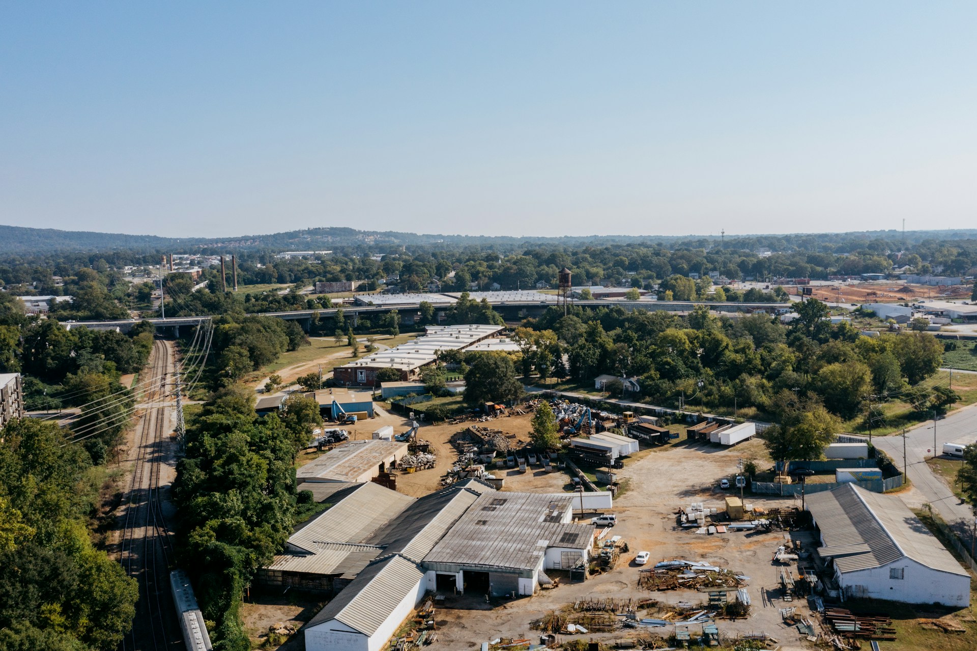 Aerial view of industrial buildings and railway tracks
