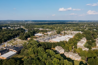 Aerial view of suburban neighborhood with trees and buildings