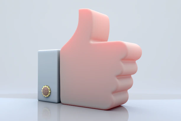 A pink thumb up symbol on a white background.