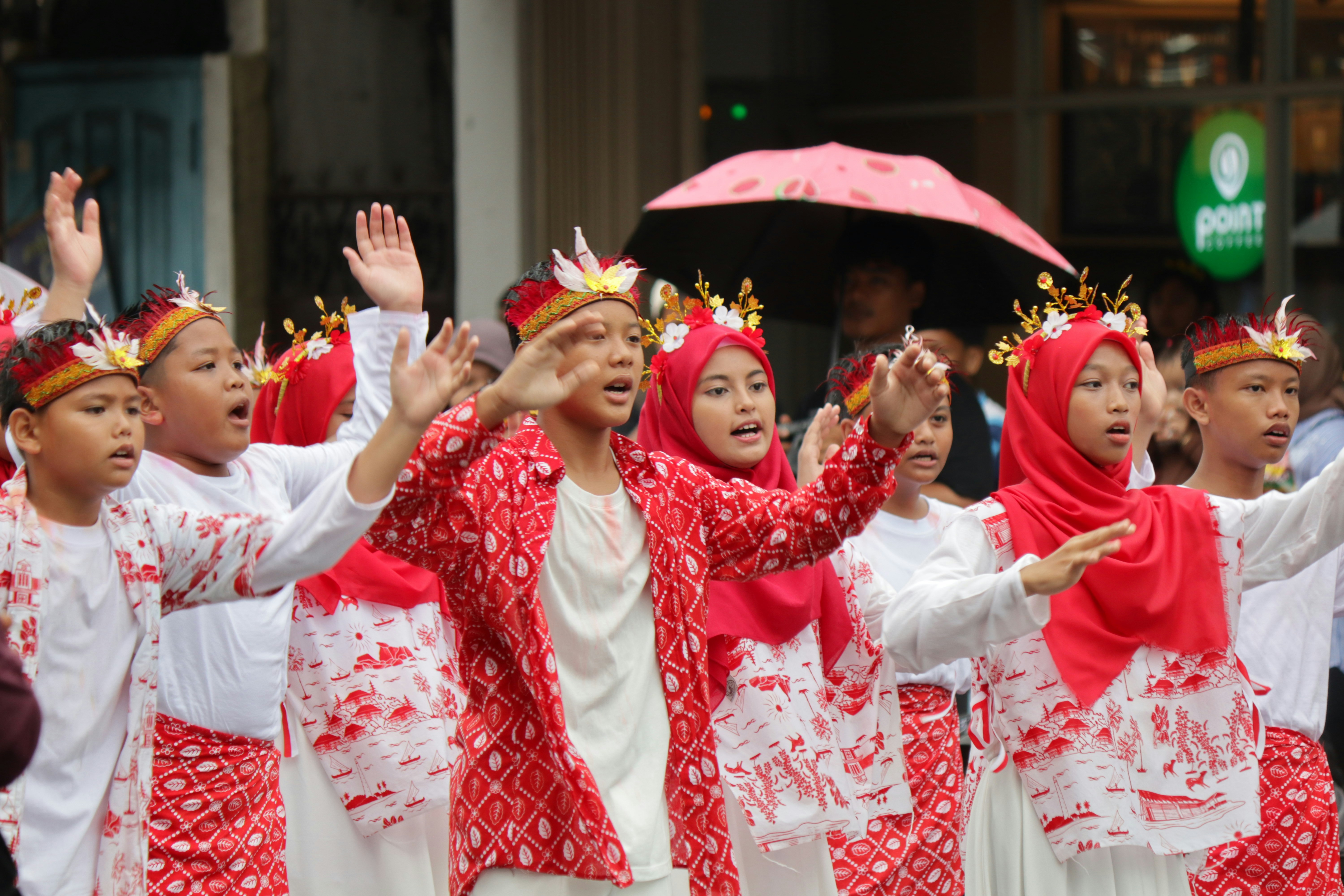 Children in traditional costumes performing outdoors