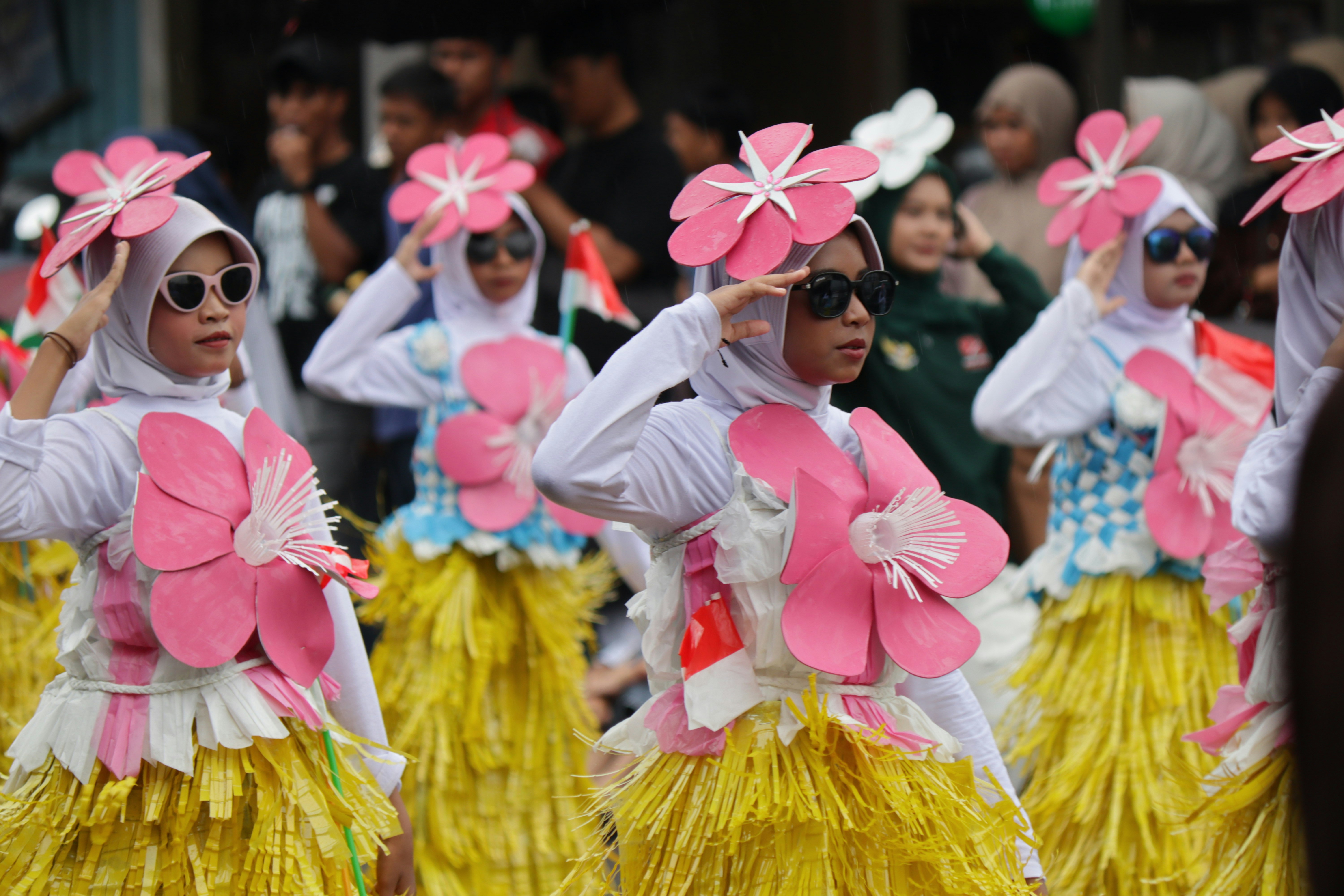 Young girls in colorful costumes participating in parade