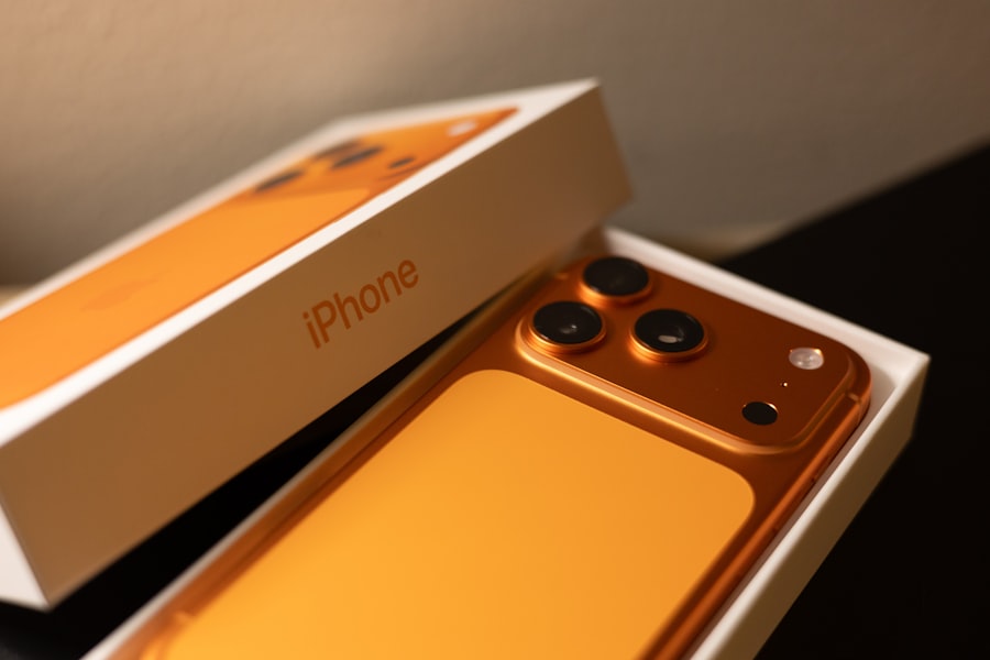Orange iPhone 17 Pro in white box packaging