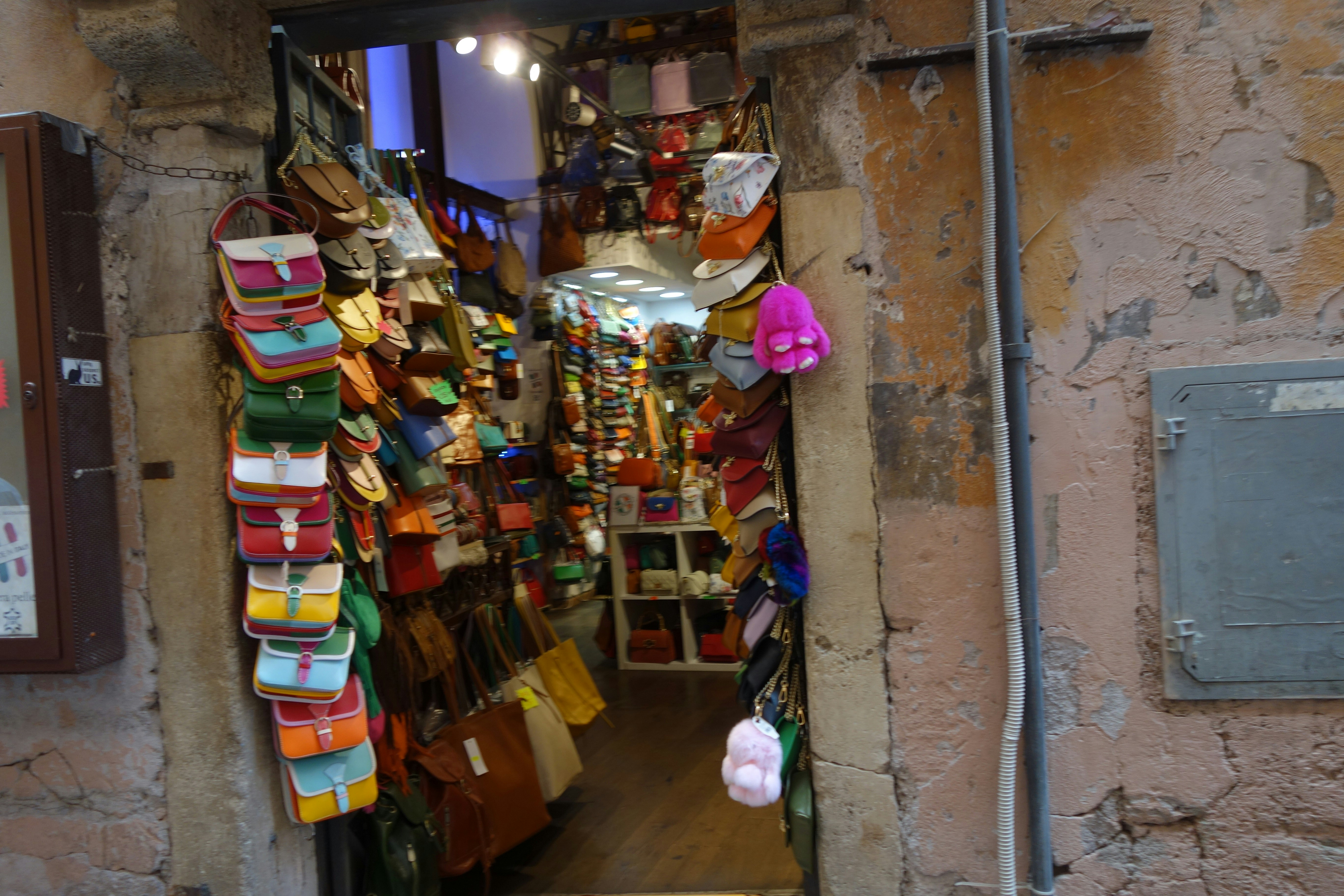 Shop entrance filled with colorful bags and accessories.