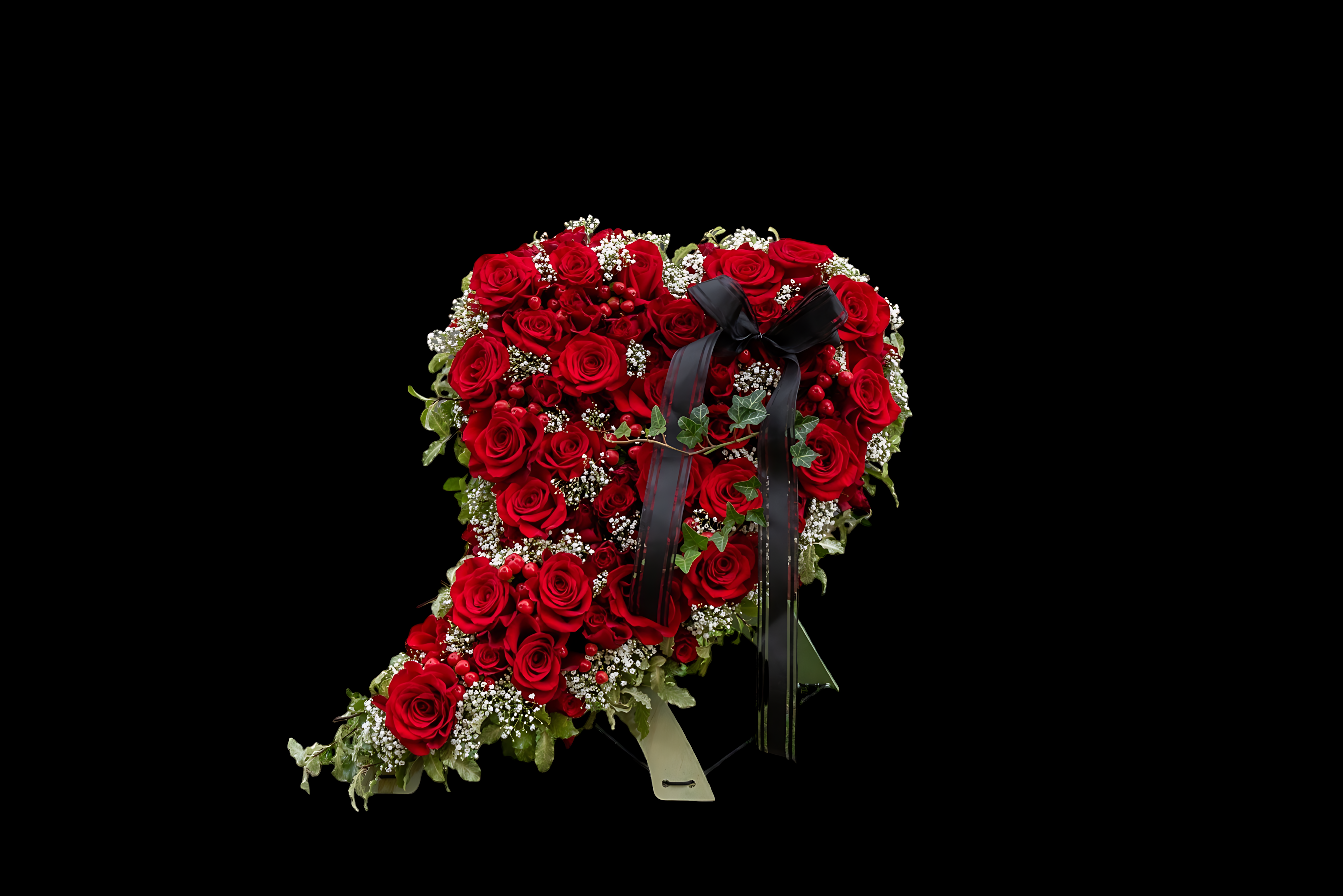 A heart-shaped bridal bouquet with red roses and eucalyptus - mexican wedding flowers