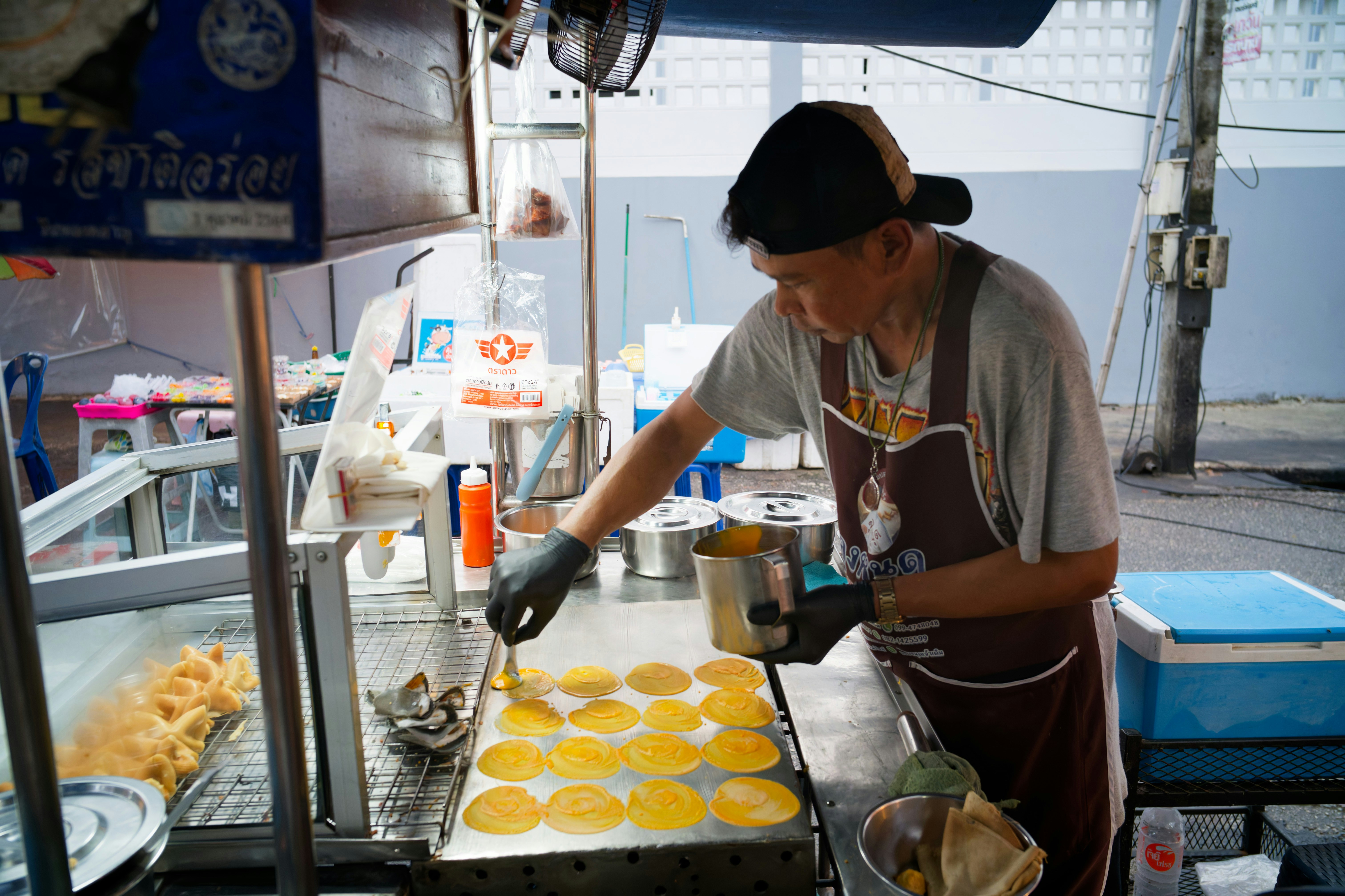 Vendor preparing food at a street stall