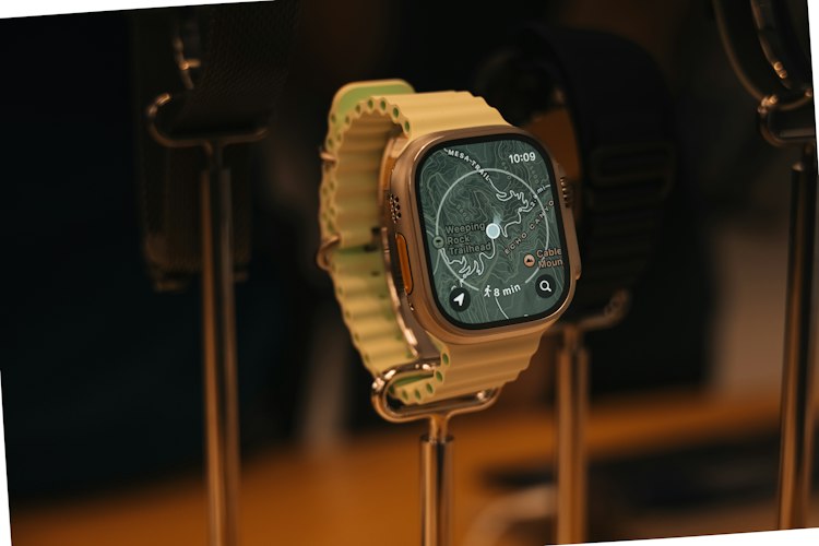A close-up of a smartwatch displaying a navigation map on someone's wrist