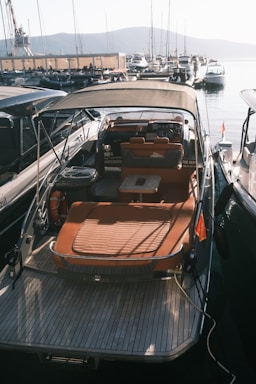 Luxury yacht docked in a marina at sunset