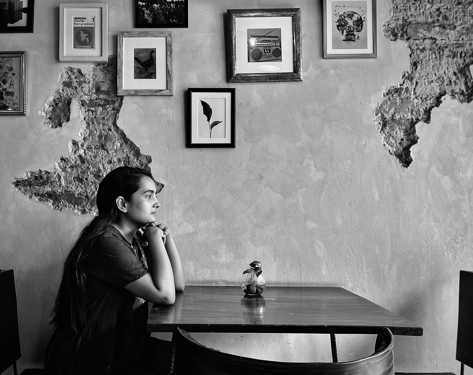 Woman sitting alone at a cafe feeling uncertain about dating again after a long relationship