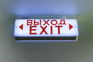Illuminated exit sign with russian text