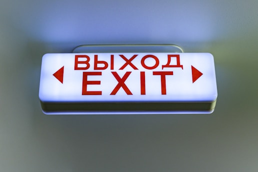 Illuminated exit sign with russian text