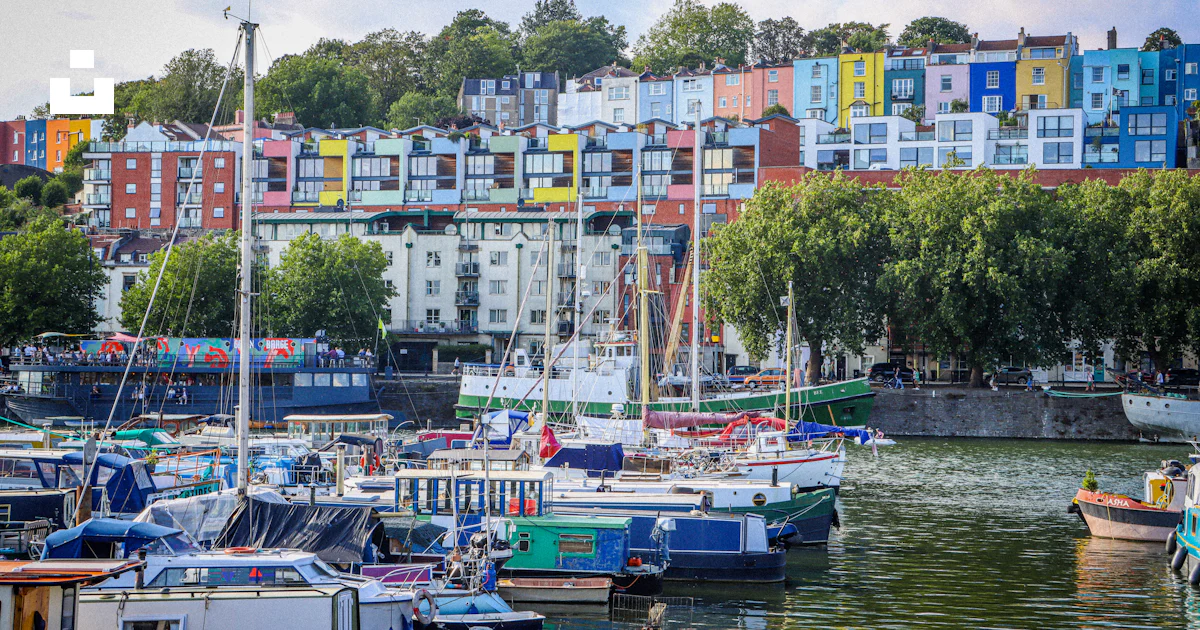 Colorful Houses Overlook A Harbor Filled With Boats Photo Free colorful-houses-overlook-a-harbor-filled-with-boats-photo-free