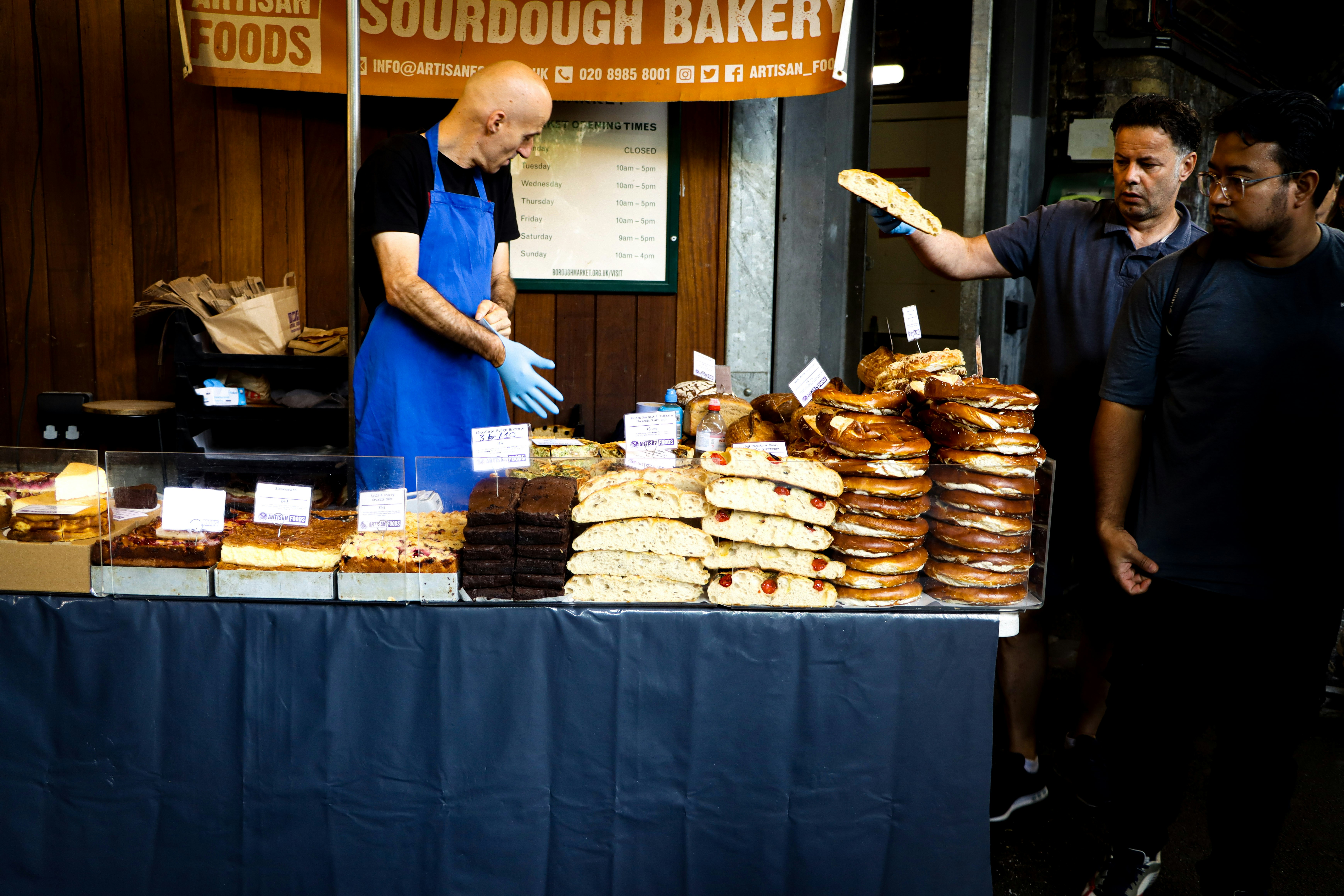 Baker serving pastries