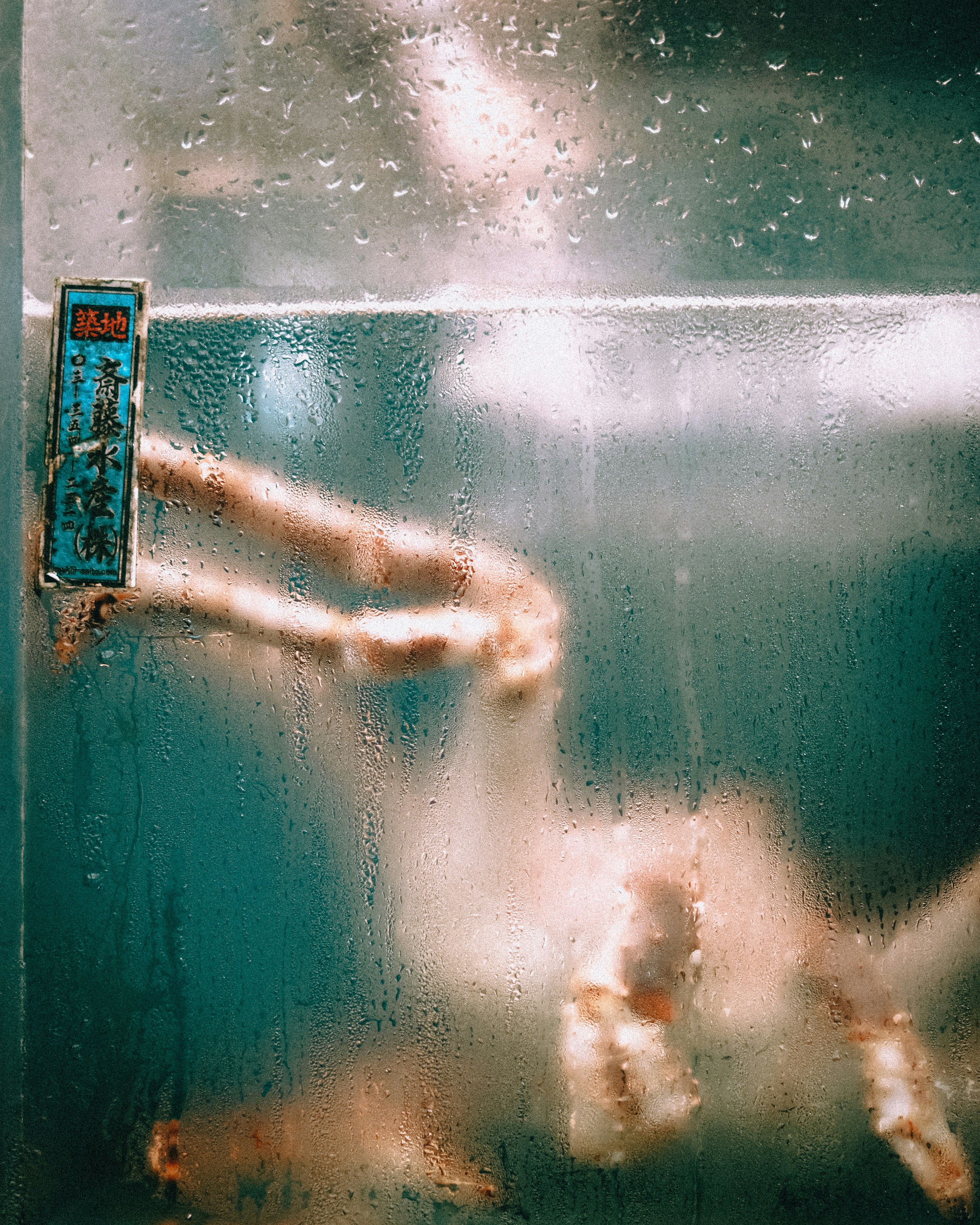 King crab legs submerged in water with condensation.